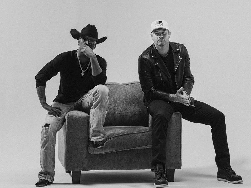 Matt Stell and Ne-Yo looking at camera in all white studio
